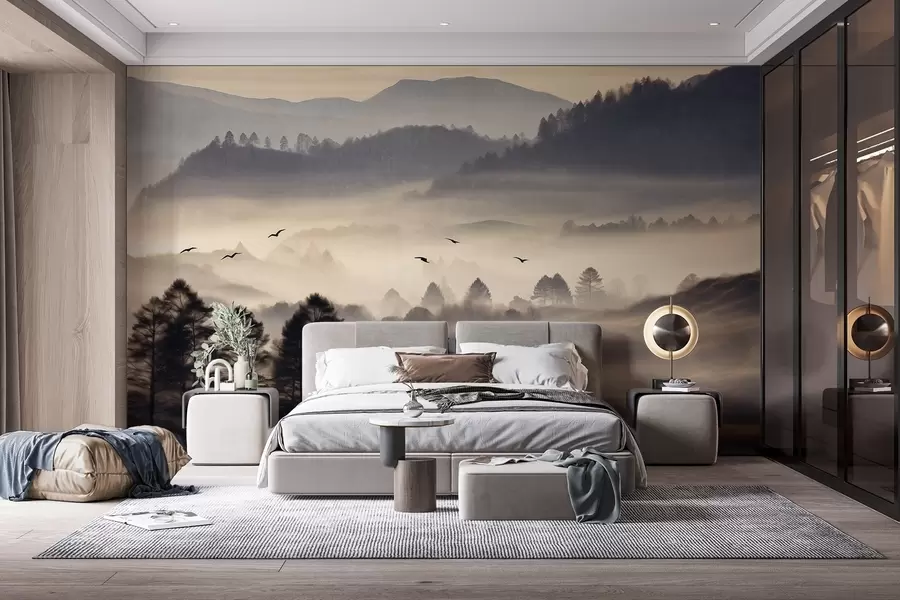 Fototapete Strukturierte Berglandschaft mit Nebelschichten, silhouettierte Bäume im Vordergrund, entfernte Bergkette, weiche Beleuchtung w09338